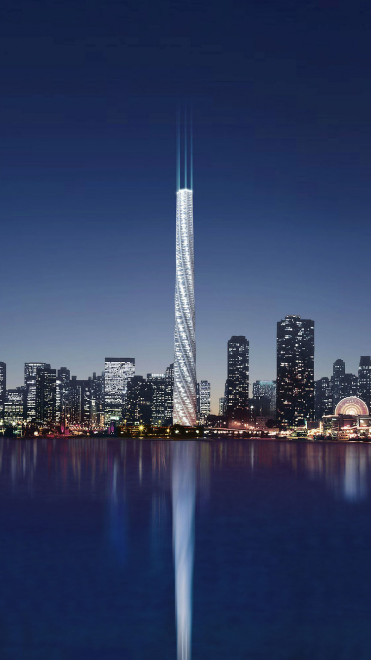 Skyline Der Stadt Über Gewässer Während Der Nacht. Wallpaper in 750x1334 Resolution
