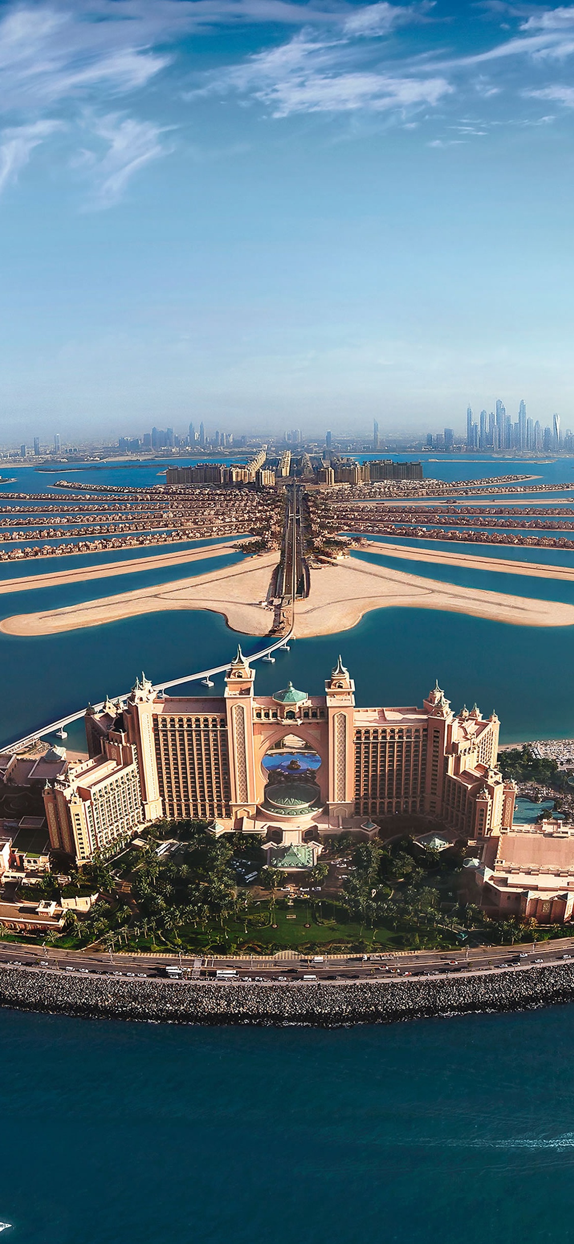 Luftaufnahme Von Stadtgebäuden in Der Nähe Von Gewässern Tagsüber. Wallpaper in 1125x2436 Resolution