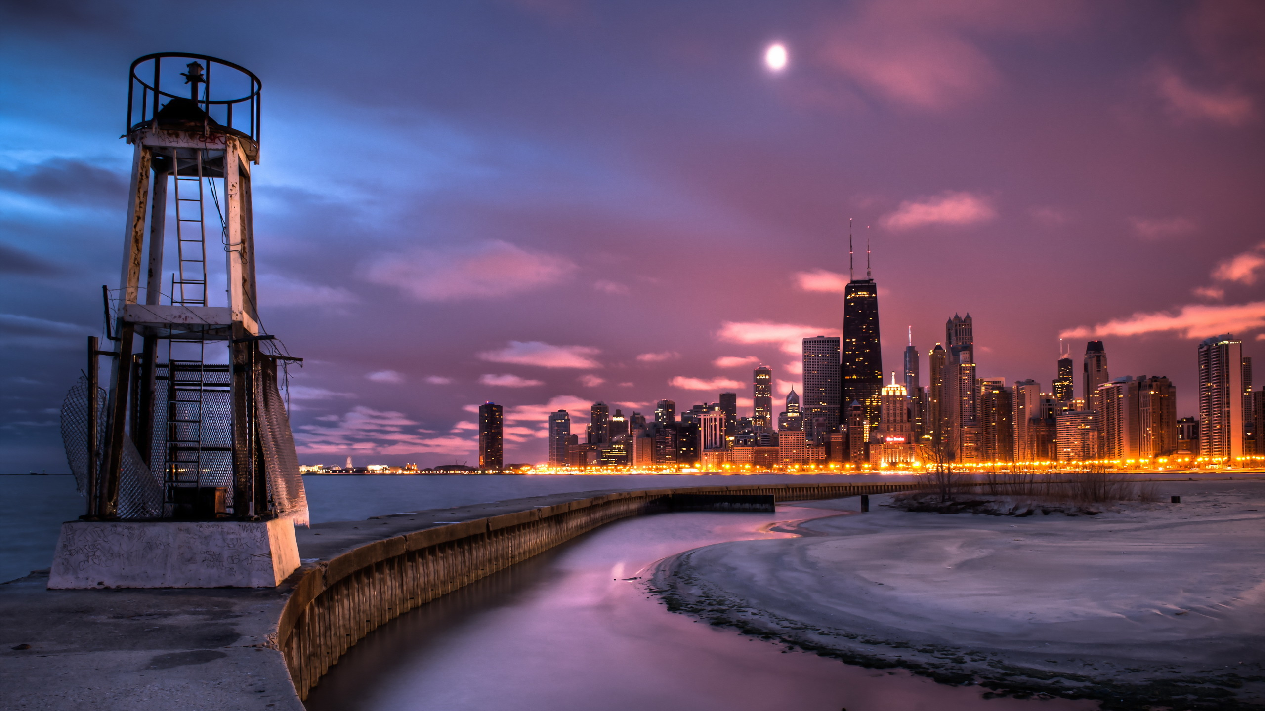 Body of Water Near City Buildings During Night Time. Wallpaper in 2560x1440 Resolution