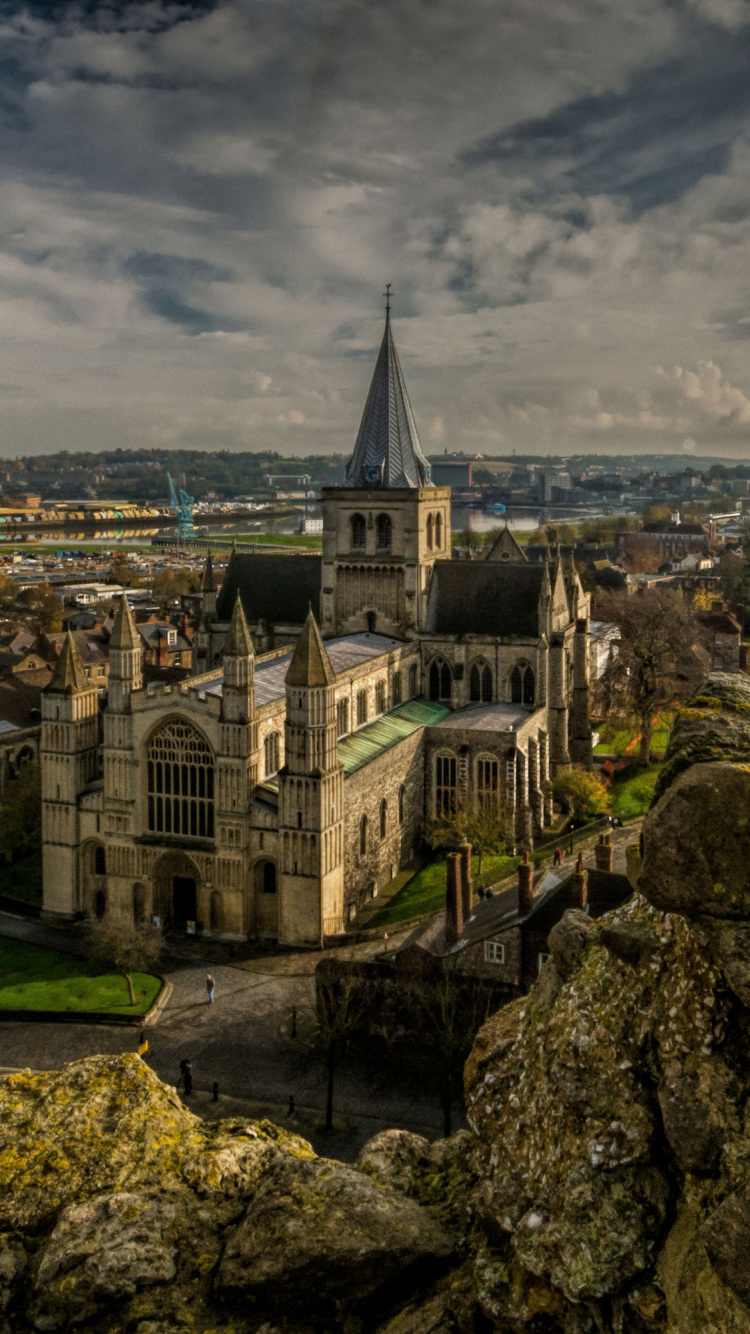 White and Brown Concrete Building Under Cloudy Sky During Daytime. Wallpaper in 750x1334 Resolution