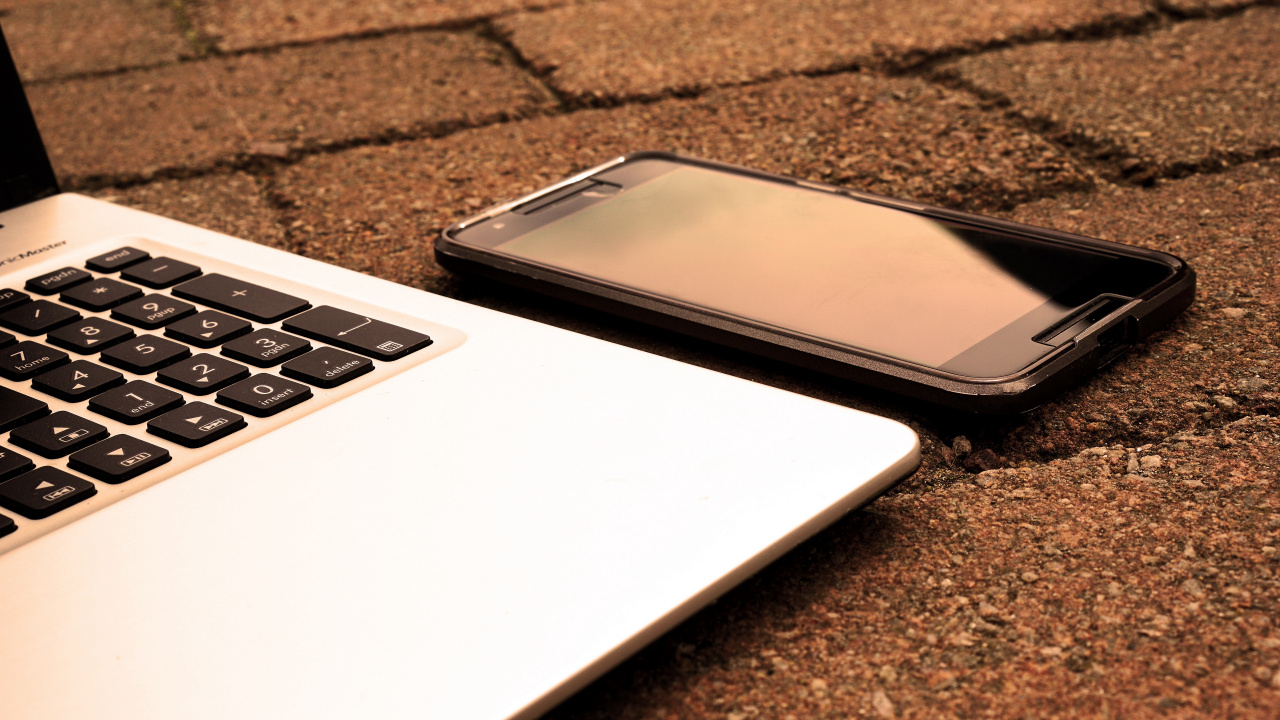 Download 1280x720 Wallpaper Black Android Smartphone on Macbook Pro Black Android Smartphone on Macbook Pro. Wallpaper in 1280x720 Resolution