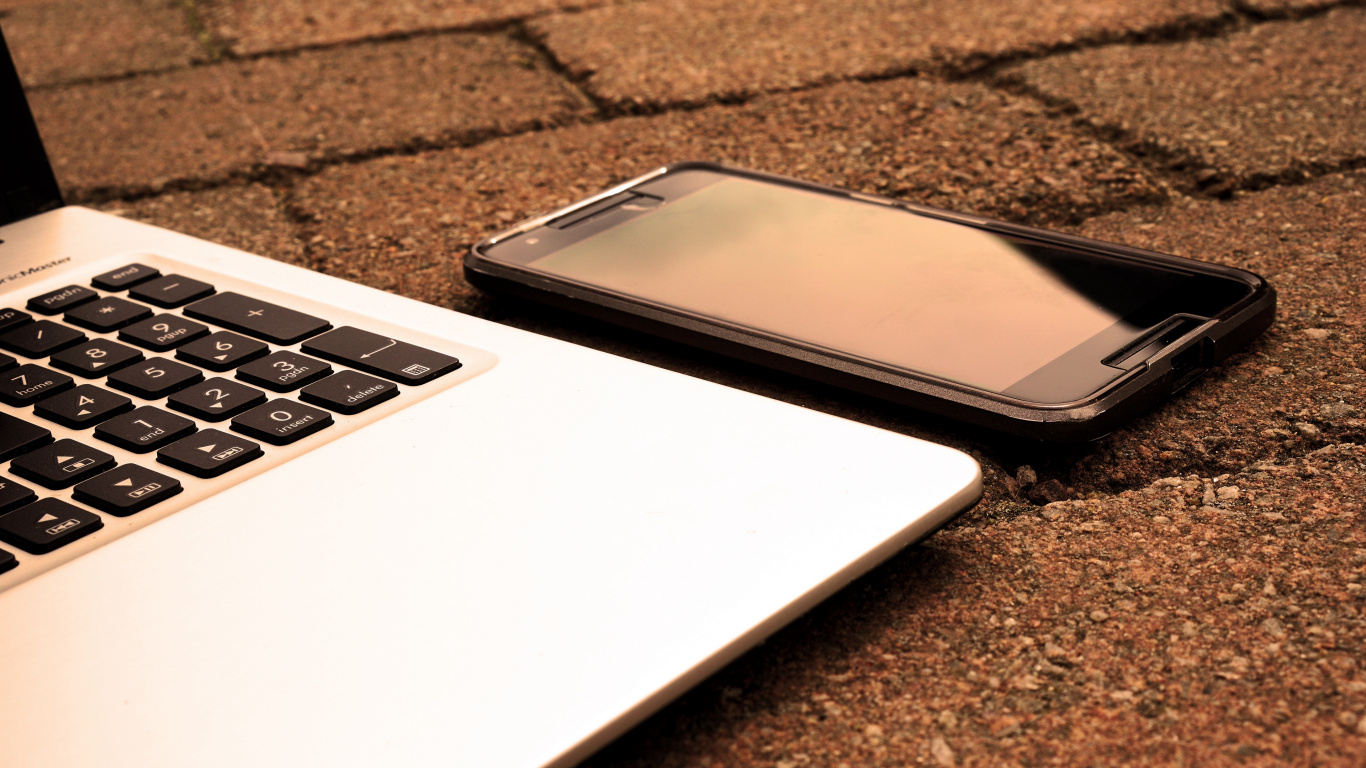 Download 1366x768 Wallpaper Black Android Smartphone on Macbook Pro Black Android Smartphone on Macbook Pro. Wallpaper in 1366x768 Resolution