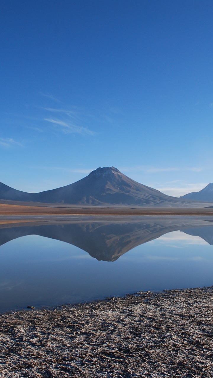 Brown Mountain Near Lake Under Blue Sky During Daytime. Wallpaper in 720x1280 Resolution