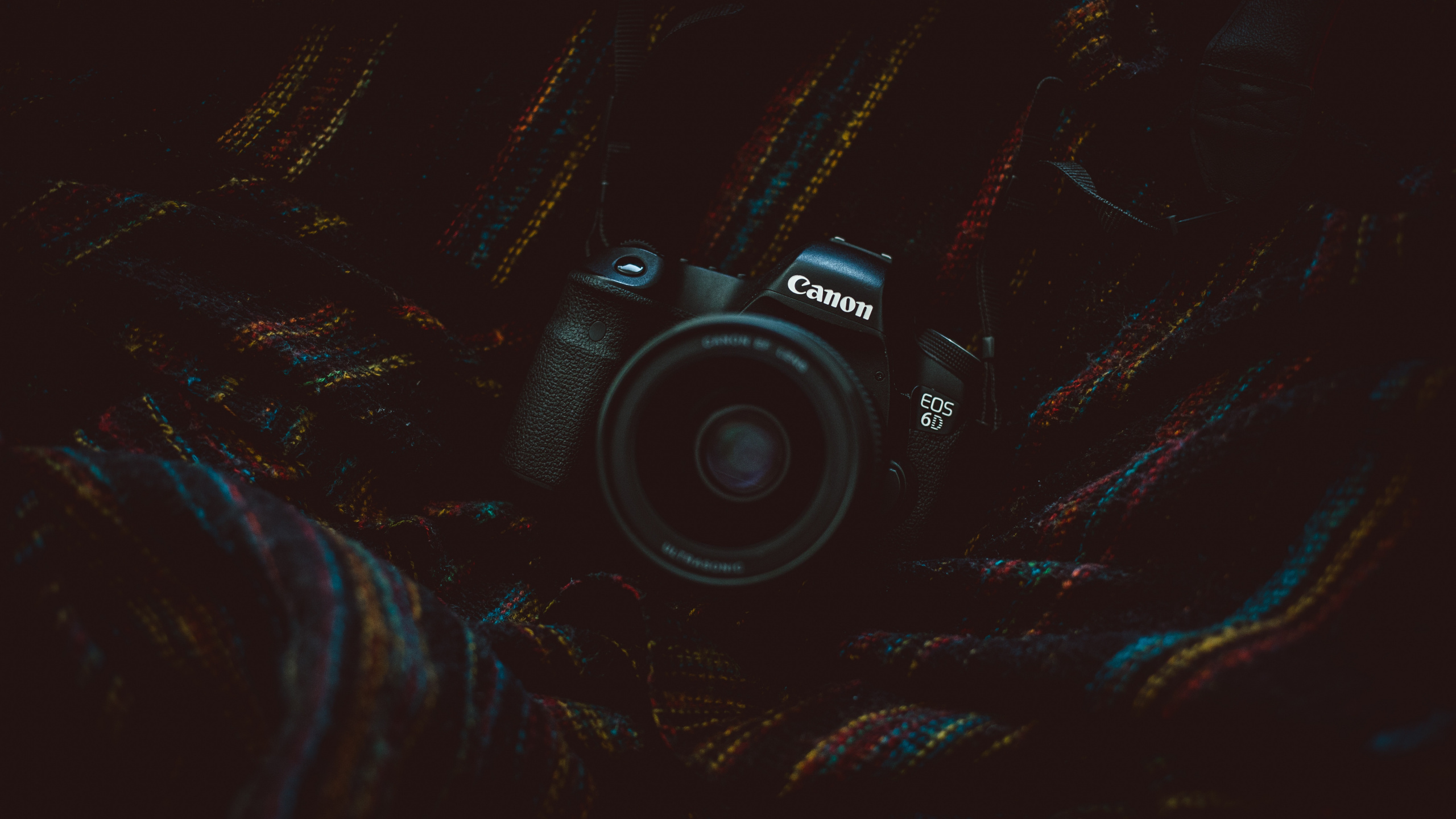 Black Nikon Dslr Camera on Black and Brown Textile. Wallpaper in 2560x1440 Resolution
