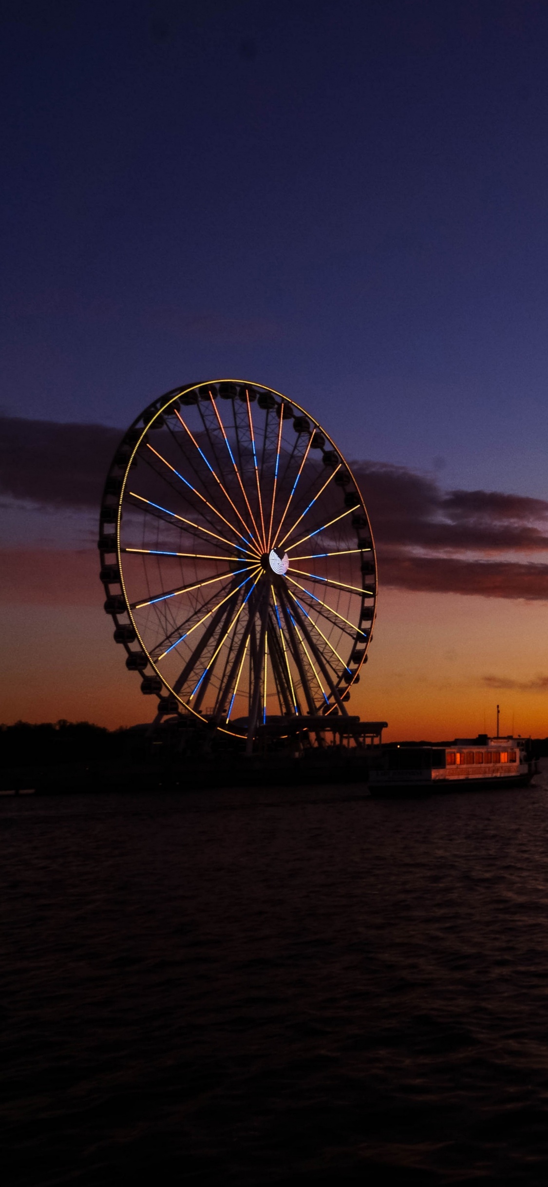 Silhouette of Ferris Wheel During Sunset. Wallpaper in 1125x2436 Resolution