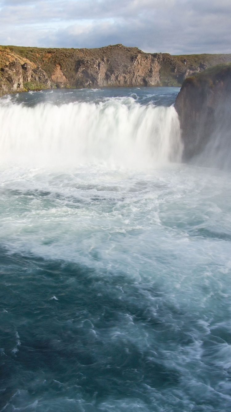 Water Falls on Brown Rocky Mountain During Daytime. Wallpaper in 750x1334 Resolution