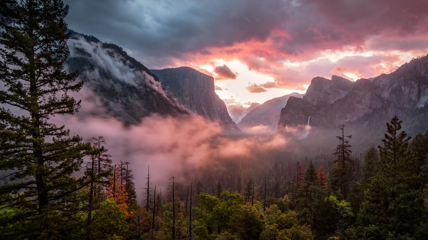 Green Trees Near Mountain Under Cloudy Sky During Daytime. Wallpaper in 1366x768 Resolution