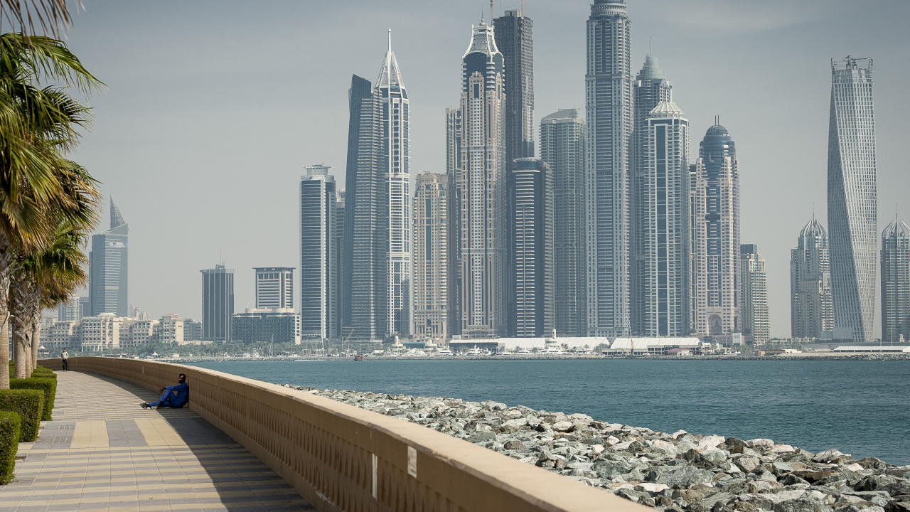 City Skyline Across The Sea During Daytime. Wallpaper in 1280x720 Resolution