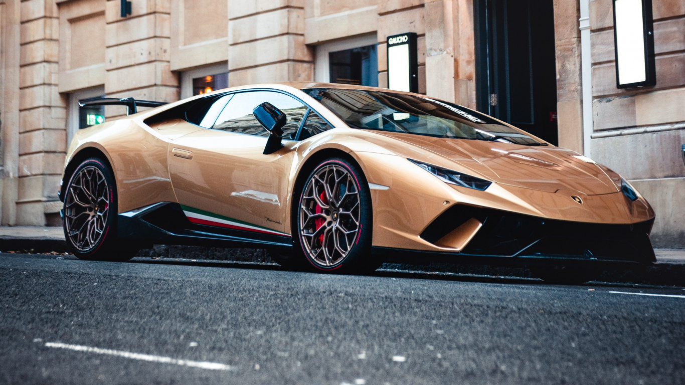 Brown Porsche 911 Parked Beside Brown Concrete Building During Daytime. Wallpaper in 1366x768 Resolution