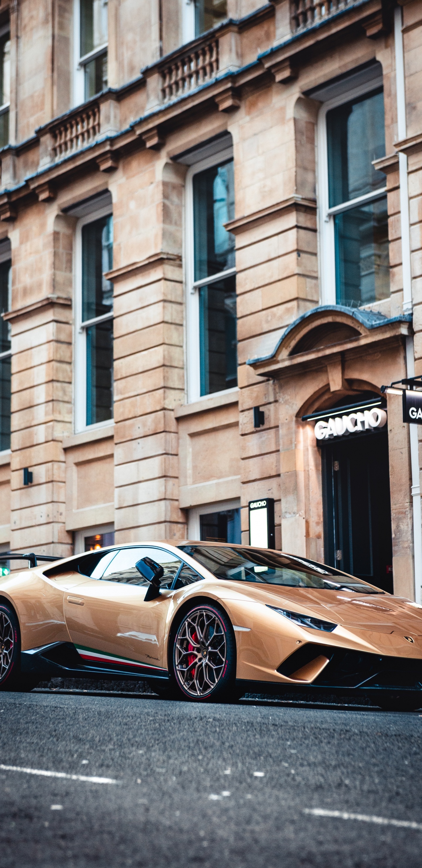 Brown Porsche 911 Parked Beside Brown Concrete Building During Daytime. Wallpaper in 1440x2960 Resolution