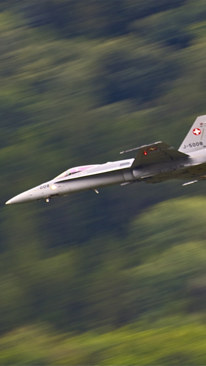 White Jet Plane Flying Over Green Grass Field During Daytime. Wallpaper in 720x1280 Resolution