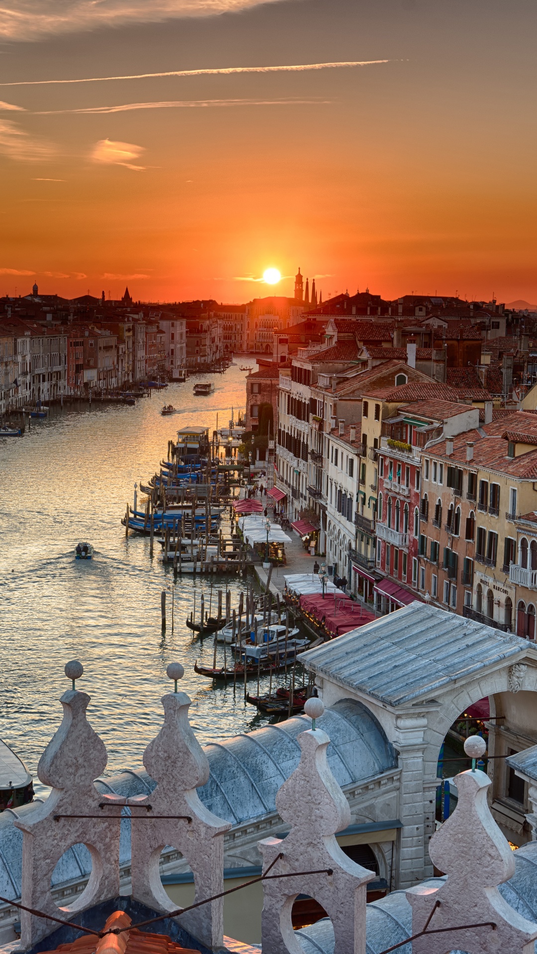 White and Brown Concrete Houses Near Body of Water During Sunset. Wallpaper in 1080x1920 Resolution
