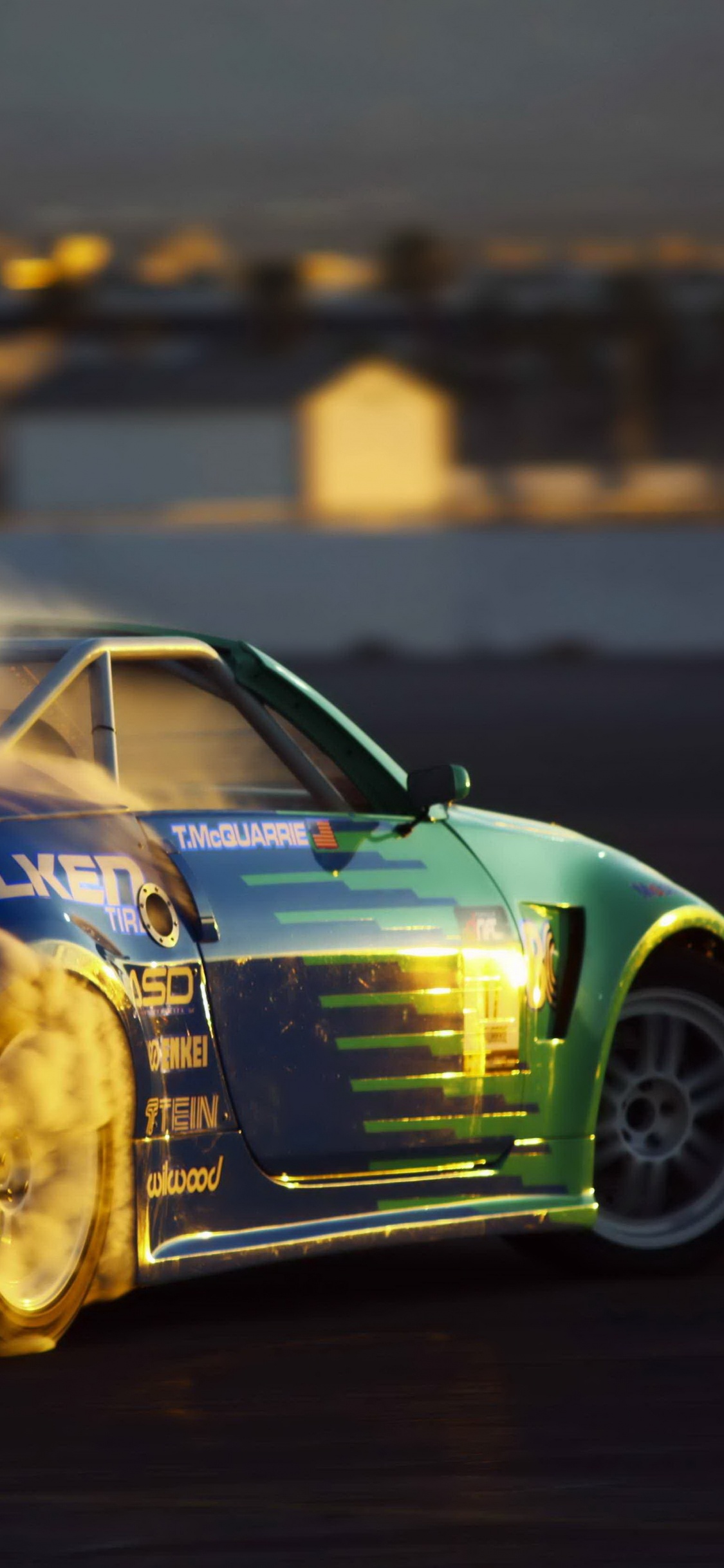 Blue and Yellow Chevrolet Camaro on Road. Wallpaper in 1125x2436 Resolution