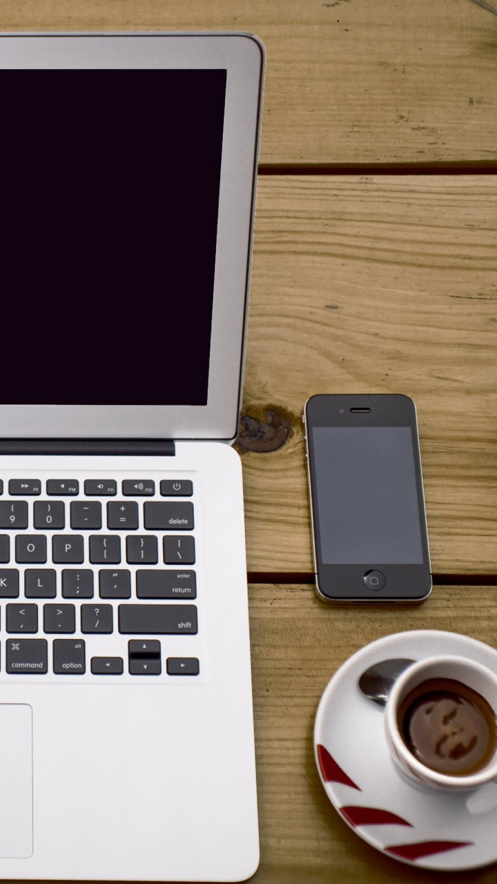 Macbook Air Beside White Ceramic Mug on Brown Wooden Table. Wallpaper in 720x1280 Resolution
