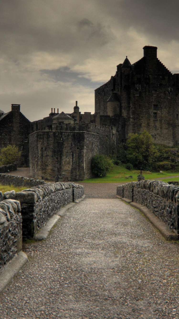 Gray Concrete Castle Under Cloudy Sky. Wallpaper in 750x1334 Resolution