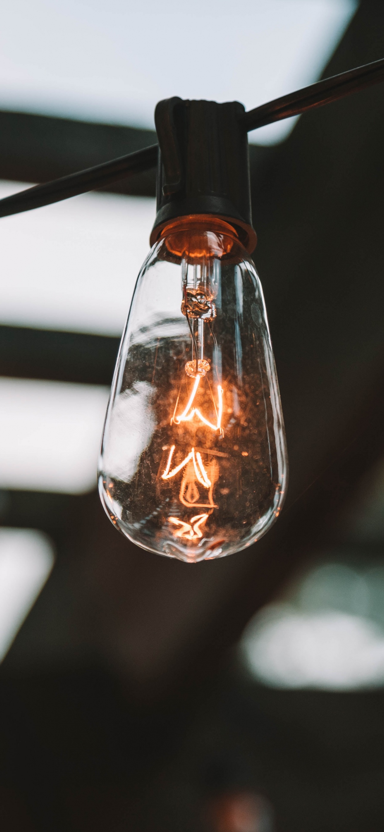 Turned on Light Bulb in Dark Room. Wallpaper in 1242x2688 Resolution