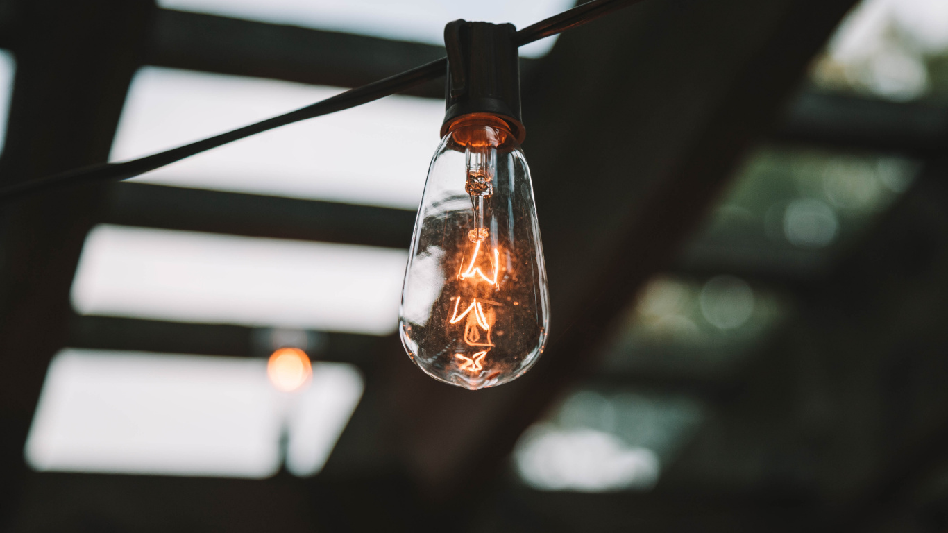 Turned on Light Bulb in Dark Room. Wallpaper in 1366x768 Resolution