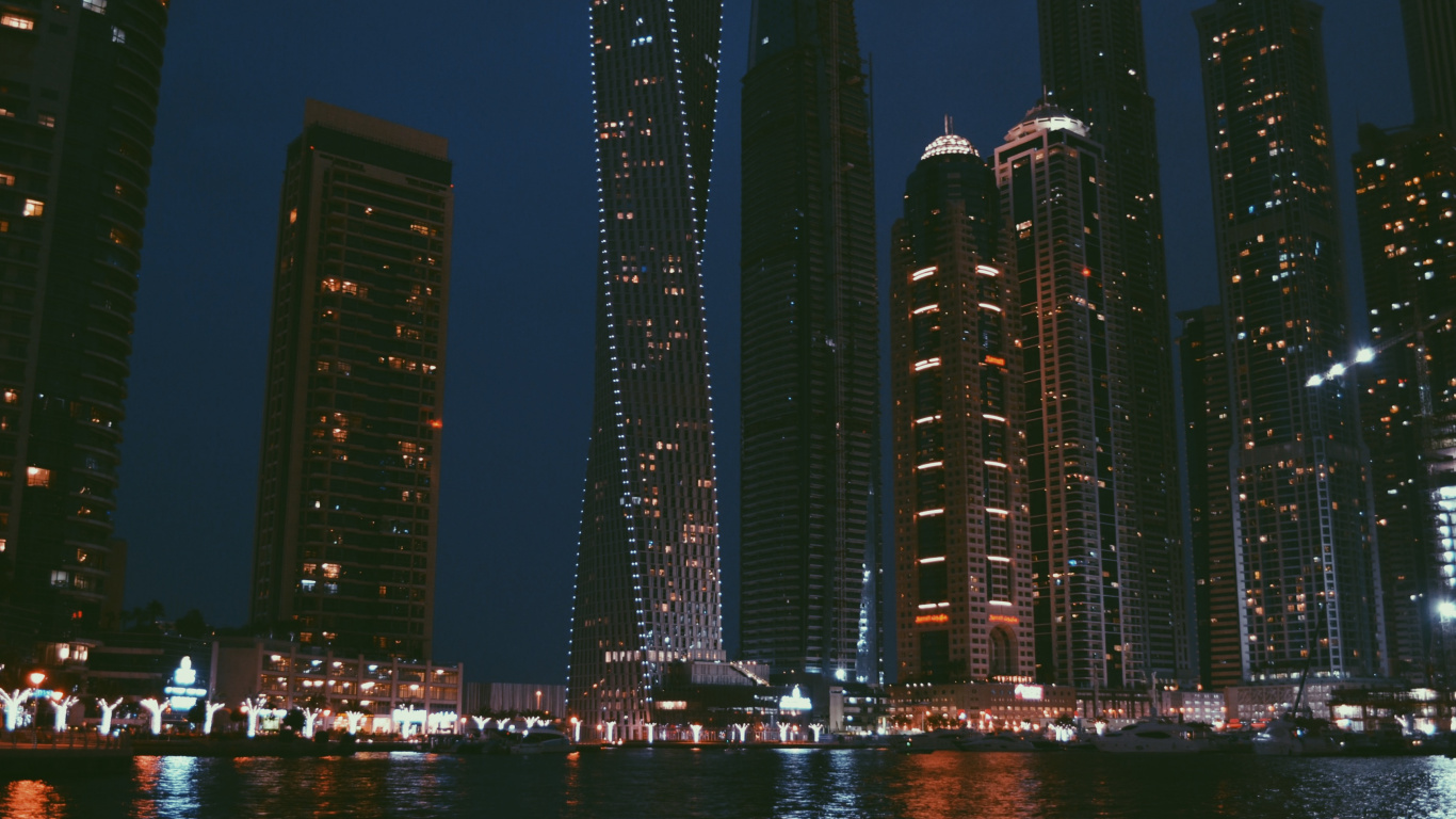 City Skyline Across Body of Water During Night Time. Wallpaper in 1366x768 Resolution