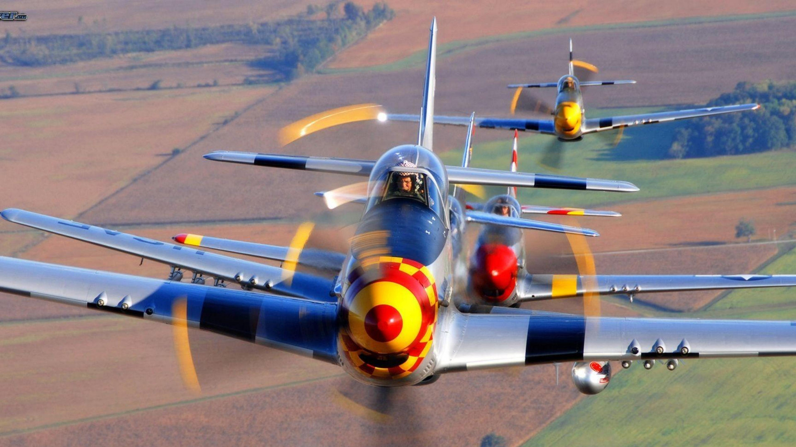 Yellow and Blue Plane on Gray Concrete Ground. Wallpaper in 2560x1440 Resolution