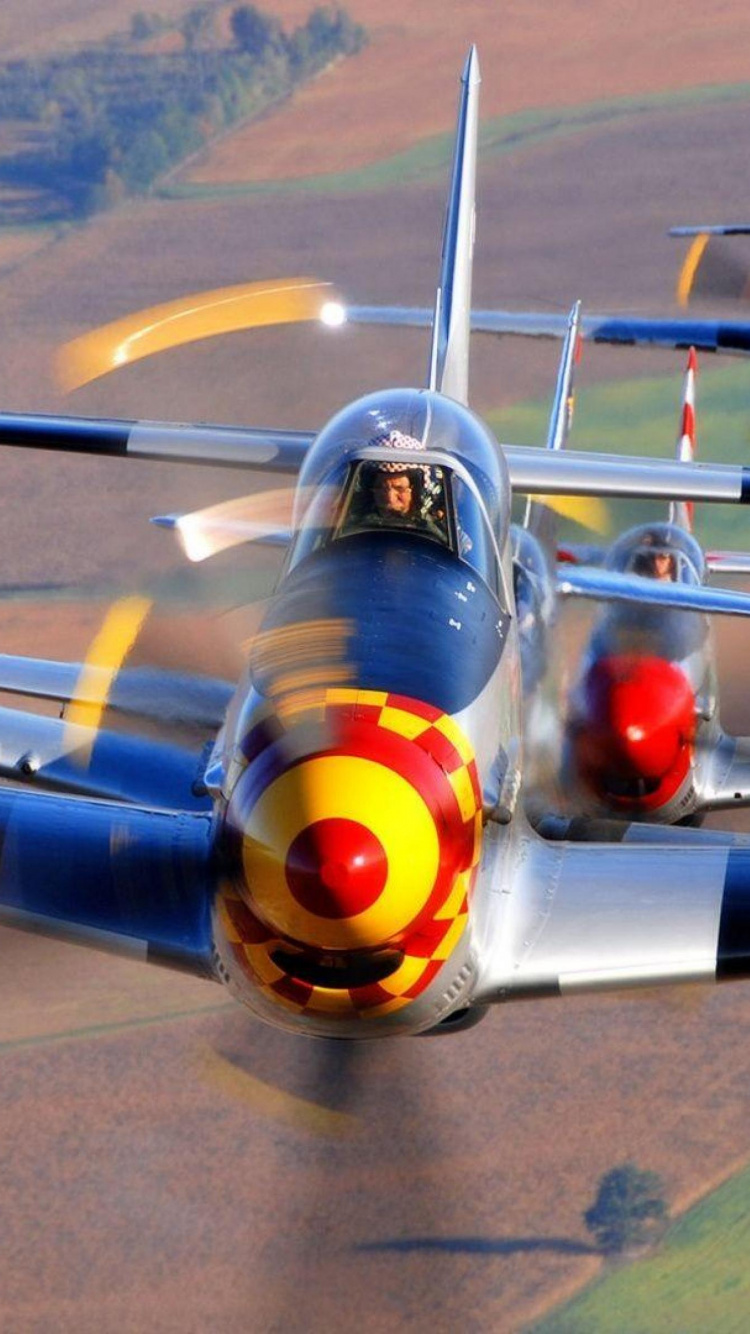 Yellow and Blue Plane on Gray Concrete Ground. Wallpaper in 750x1334 Resolution