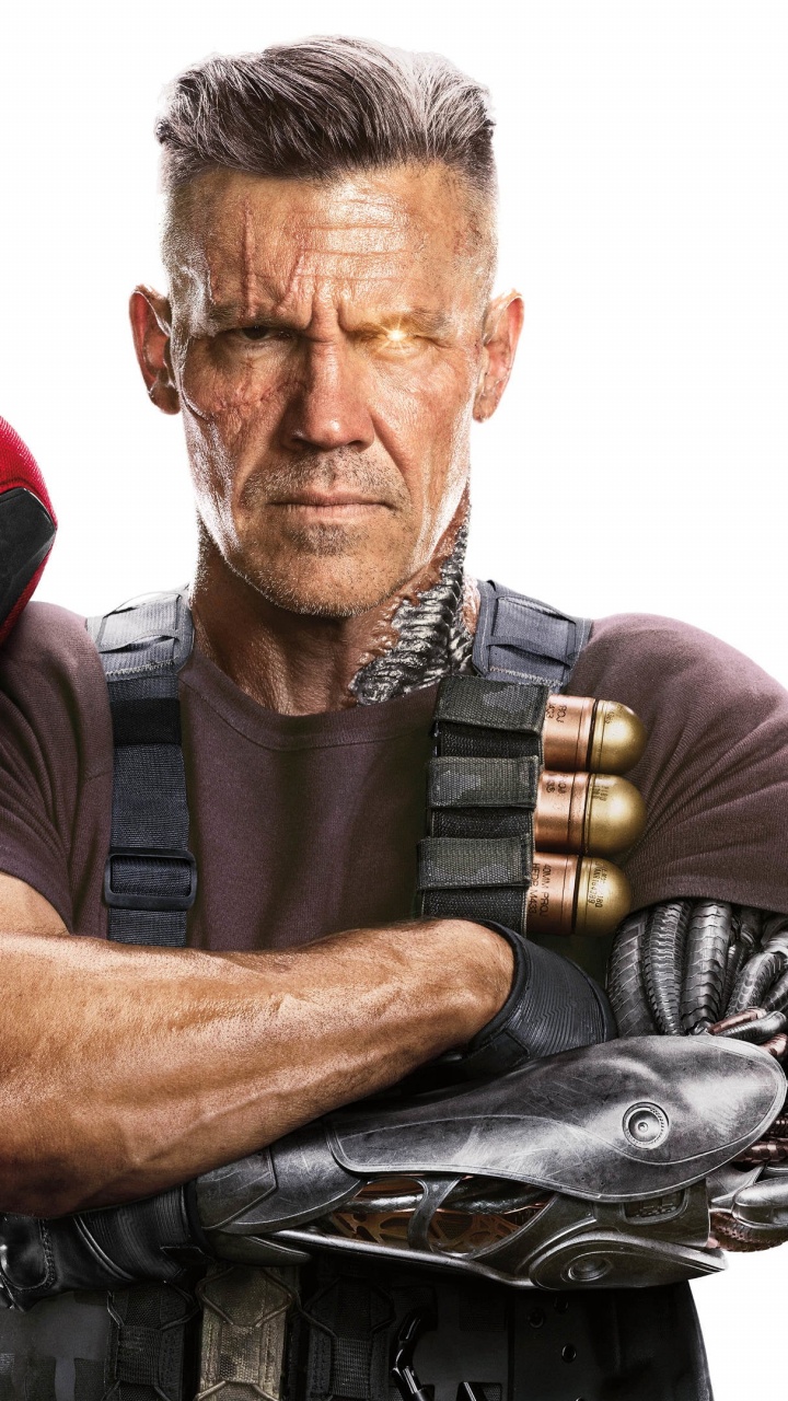 Man in Gray Crew Neck T-shirt Beside Red and Black Mask. Wallpaper in 720x1280 Resolution