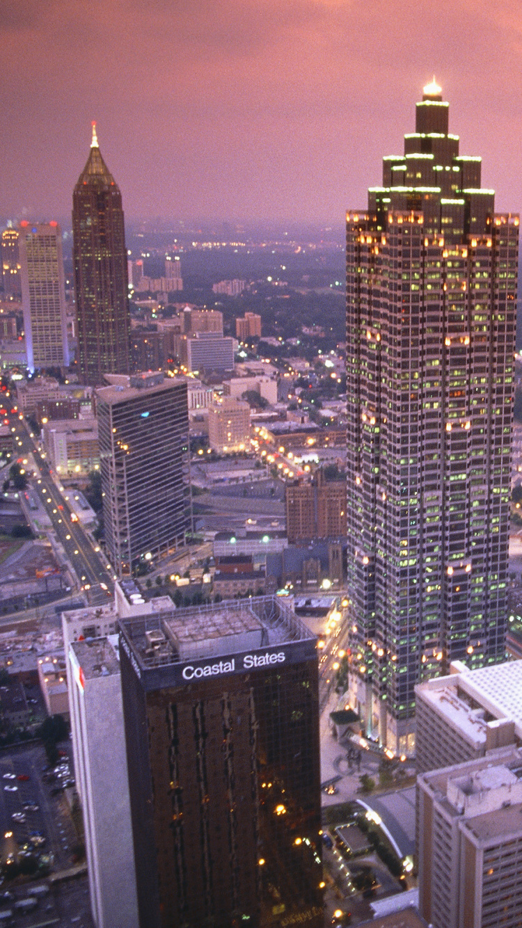 Aerial View of City Buildings During Night Time. Wallpaper in 750x1334 Resolution