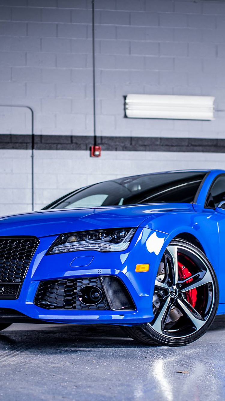 Blue Audi r 8 Parked in Garage. Wallpaper in 750x1334 Resolution