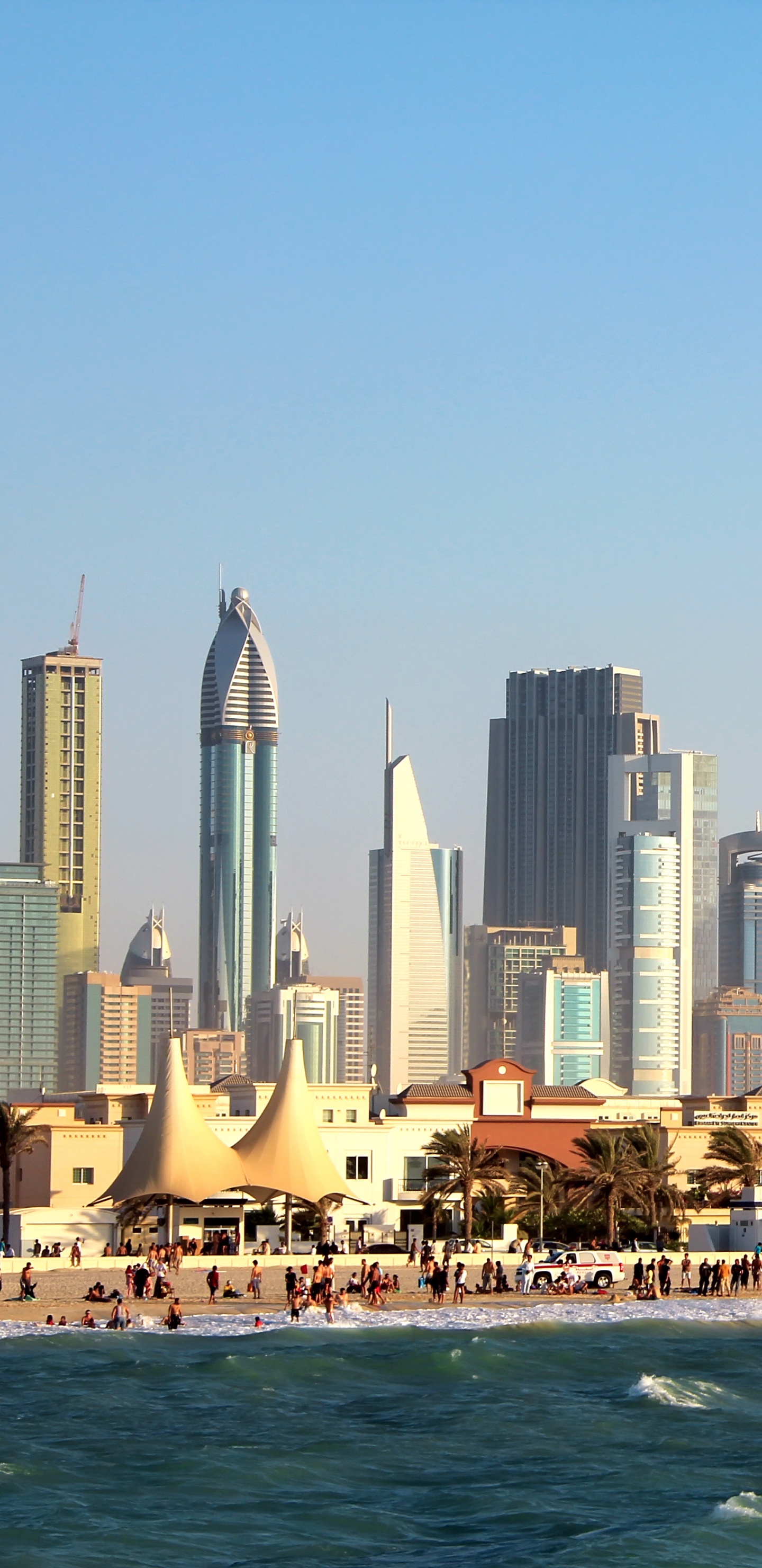 City Skyline Across Body of Water During Daytime. Wallpaper in 1440x2960 Resolution