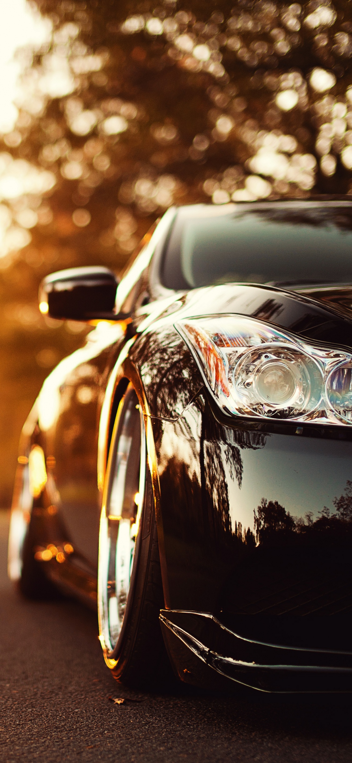 Black Porsche 911 on Road During Sunset. Wallpaper in 1125x2436 Resolution