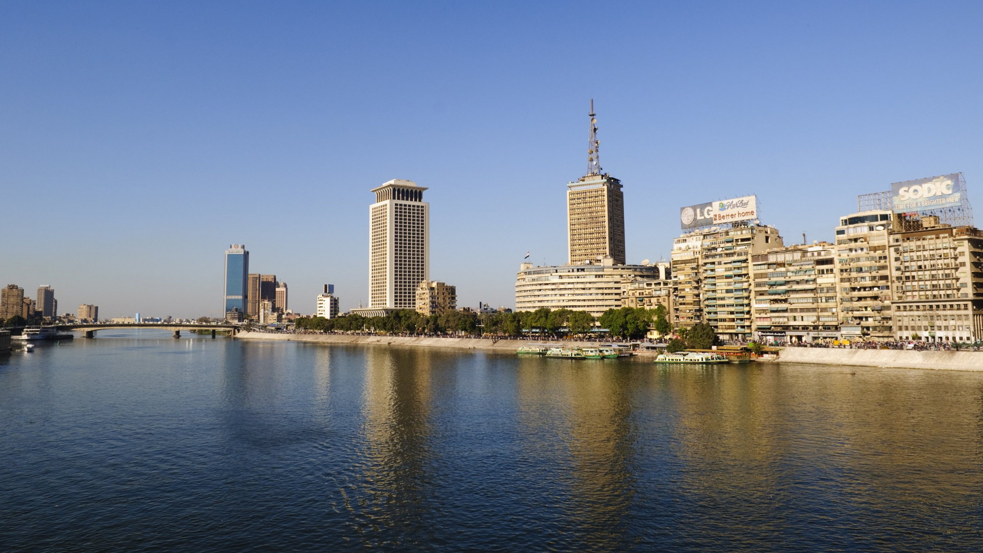 City Skyline Across Body of Water During Daytime. Wallpaper in 1920x1080 Resolution