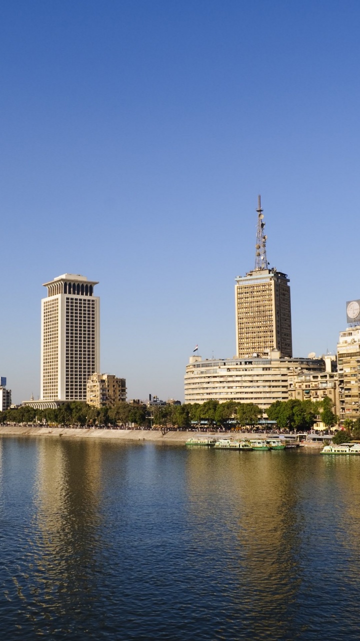 City Skyline Across Body of Water During Daytime. Wallpaper in 720x1280 Resolution