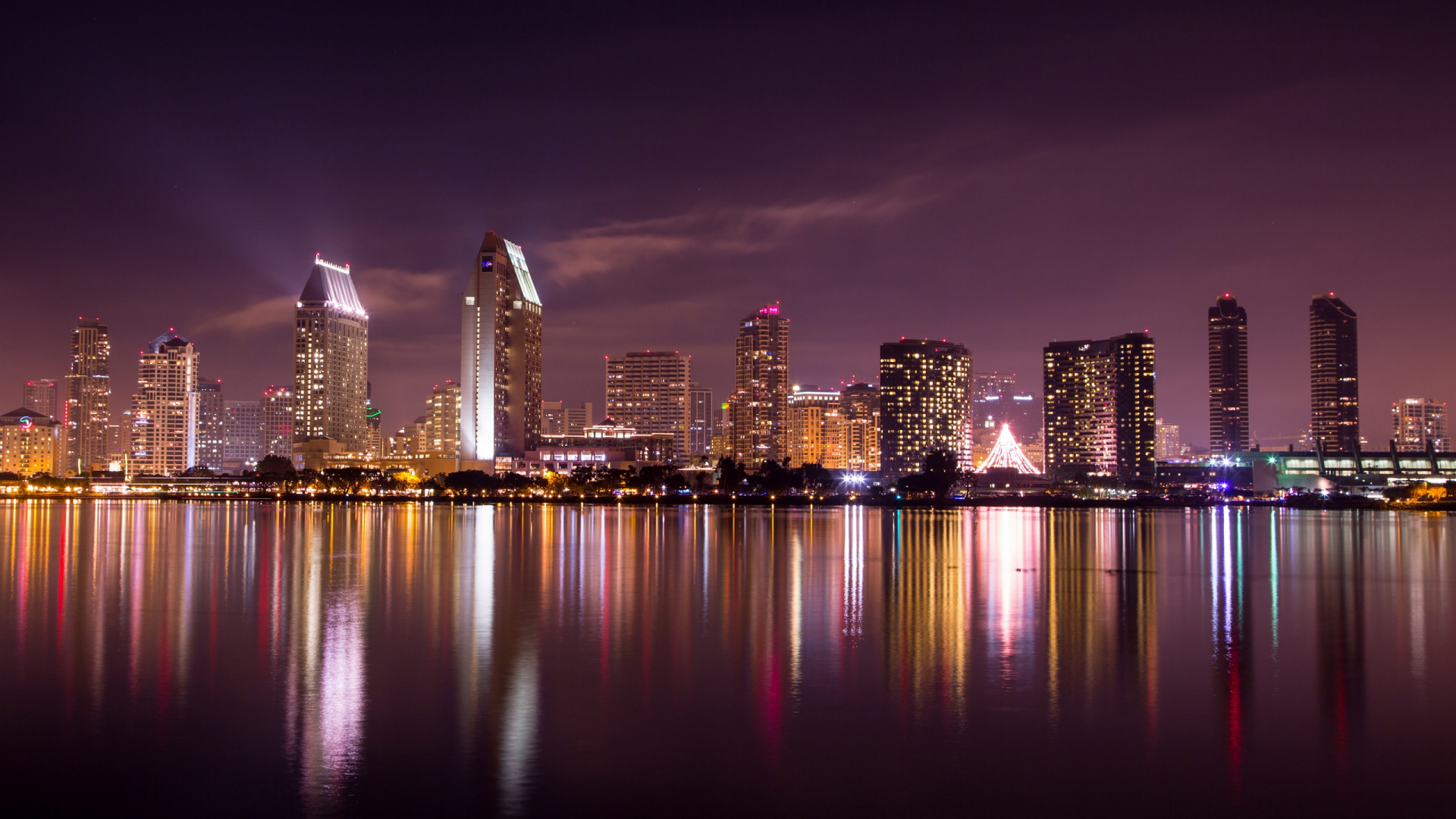 City Skyline Across Body of Water During Night Time. Wallpaper in 1920x1080 Resolution