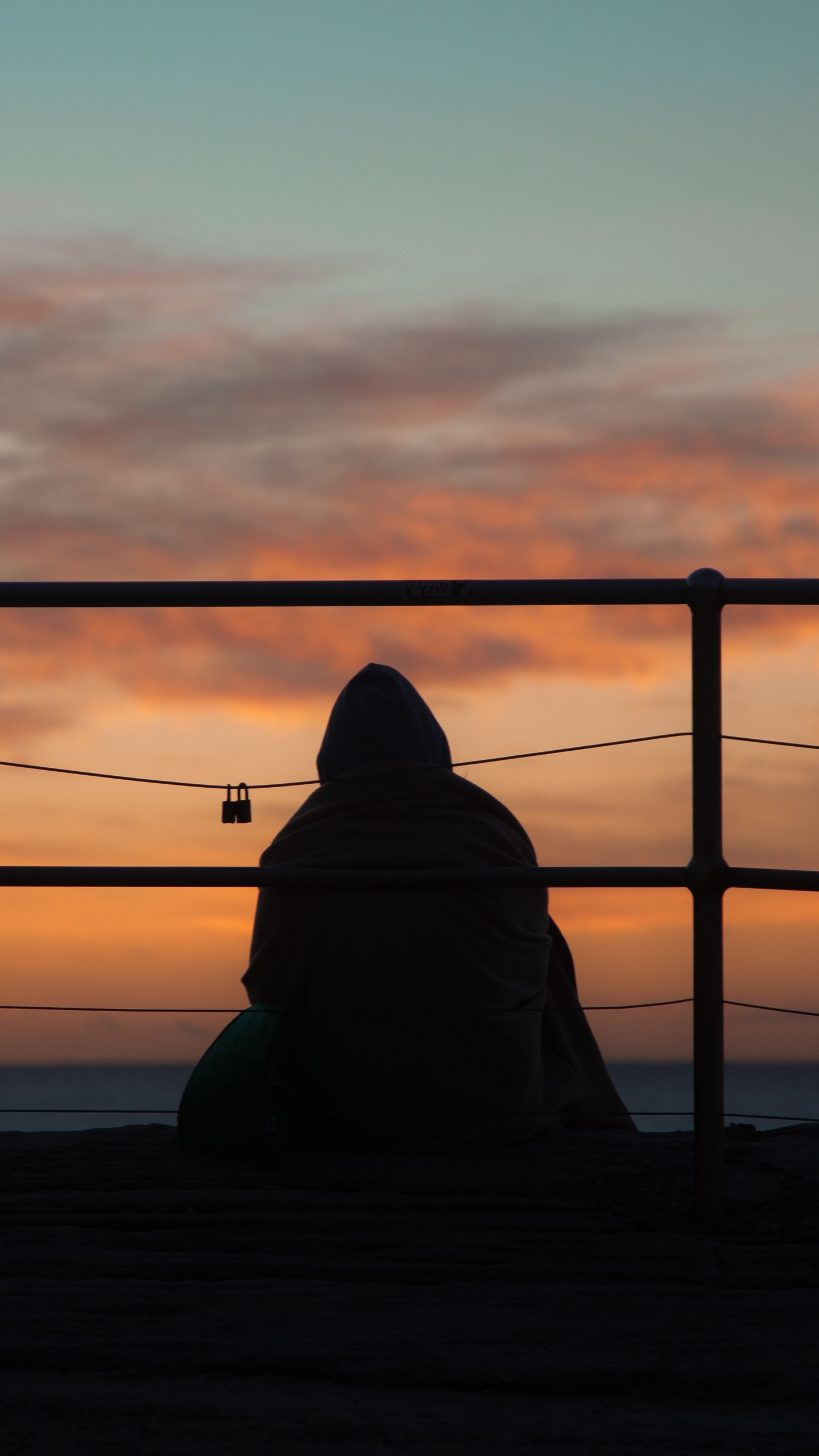 Silhouette of Person Sitting on Wooden Dock During Sunset. Wallpaper in 1440x2560 Resolution
