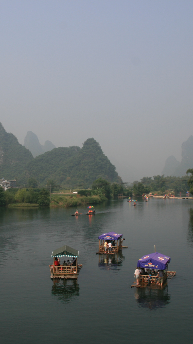 People Riding Boat on Lake During Daytime. Wallpaper in 750x1334 Resolution