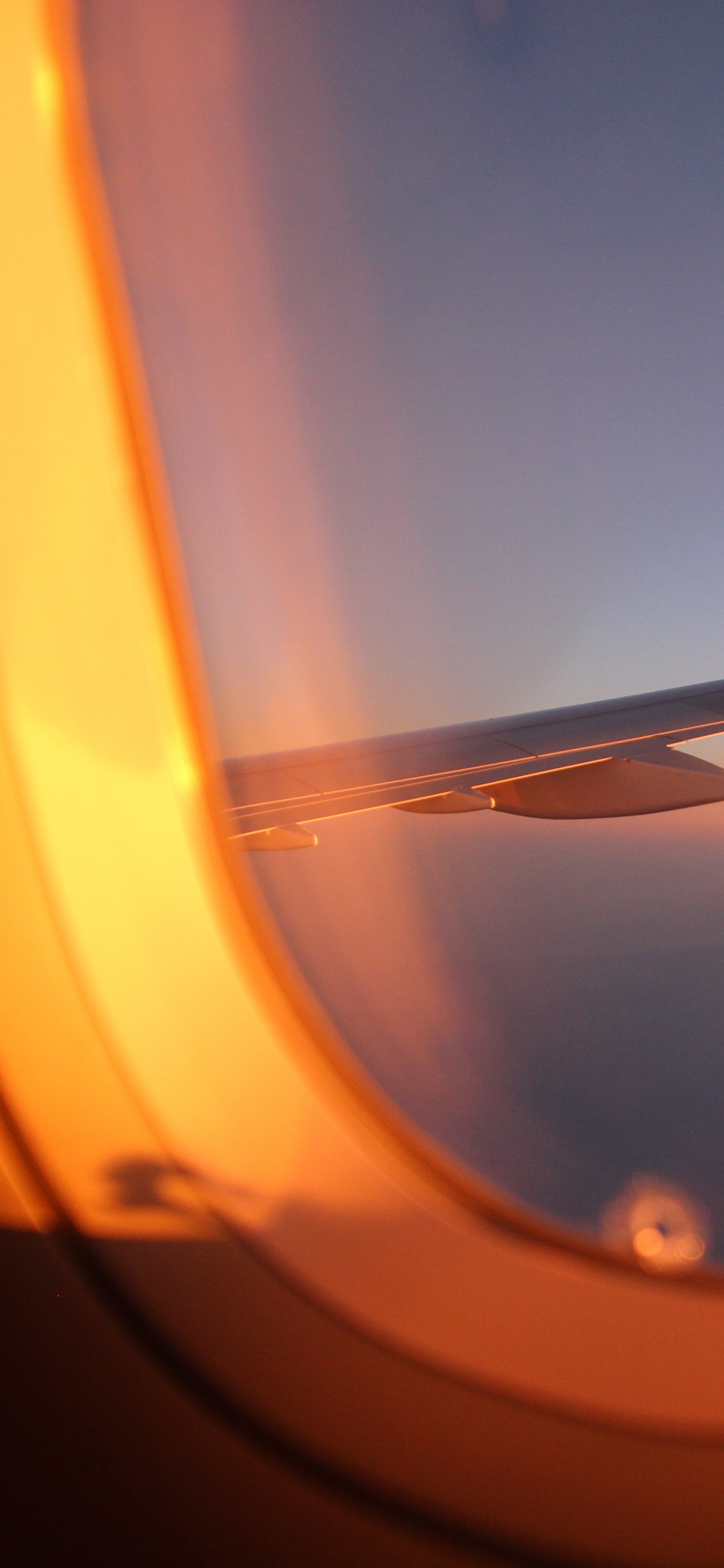 Airplane Window View of Orange and White Sky During Daytime. Wallpaper in 1242x2688 Resolution