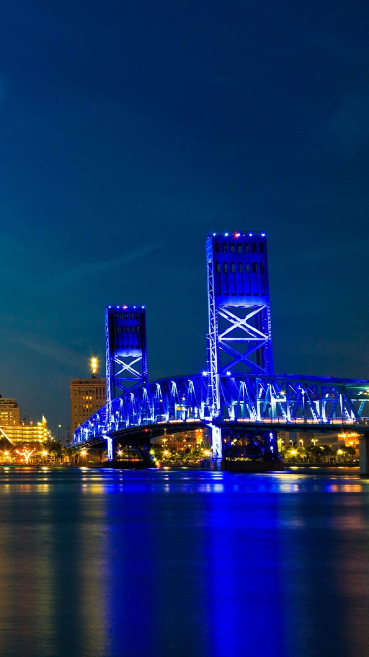 City Skyline Across Body of Water During Night Time. Wallpaper in 750x1334 Resolution