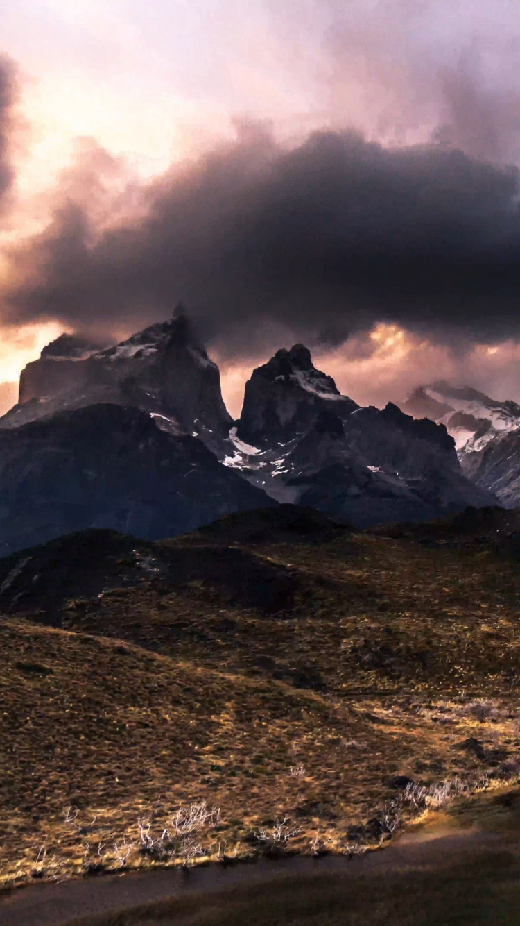 Snow Covered Mountain Under Cloudy Sky During Daytime. Wallpaper in 750x1334 Resolution