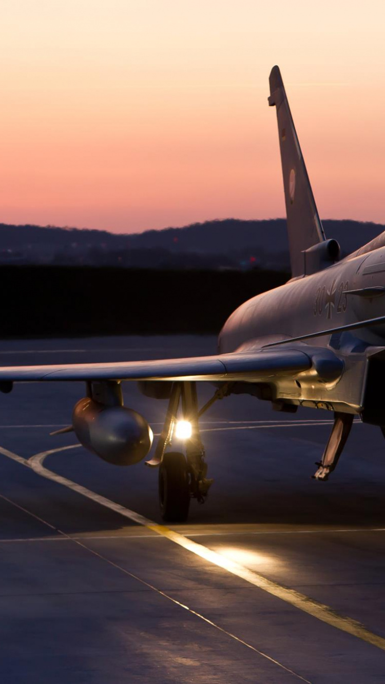 Gray Fighter Plane on Airport During Daytime. Wallpaper in 750x1334 Resolution