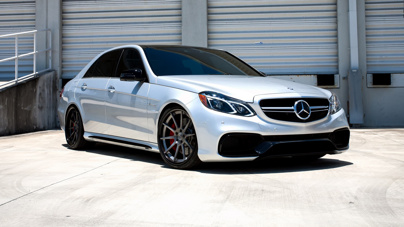 Silver Mercedes Benz Coupe Parked Near White Building. Wallpaper in 1366x768 Resolution