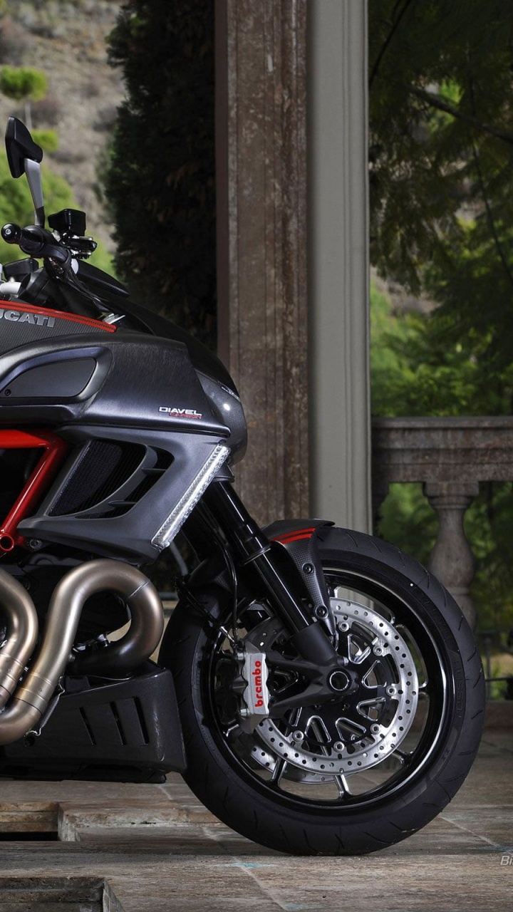 Black and Red Sports Bike Parked Beside Green Plants During Daytime. Wallpaper in 720x1280 Resolution