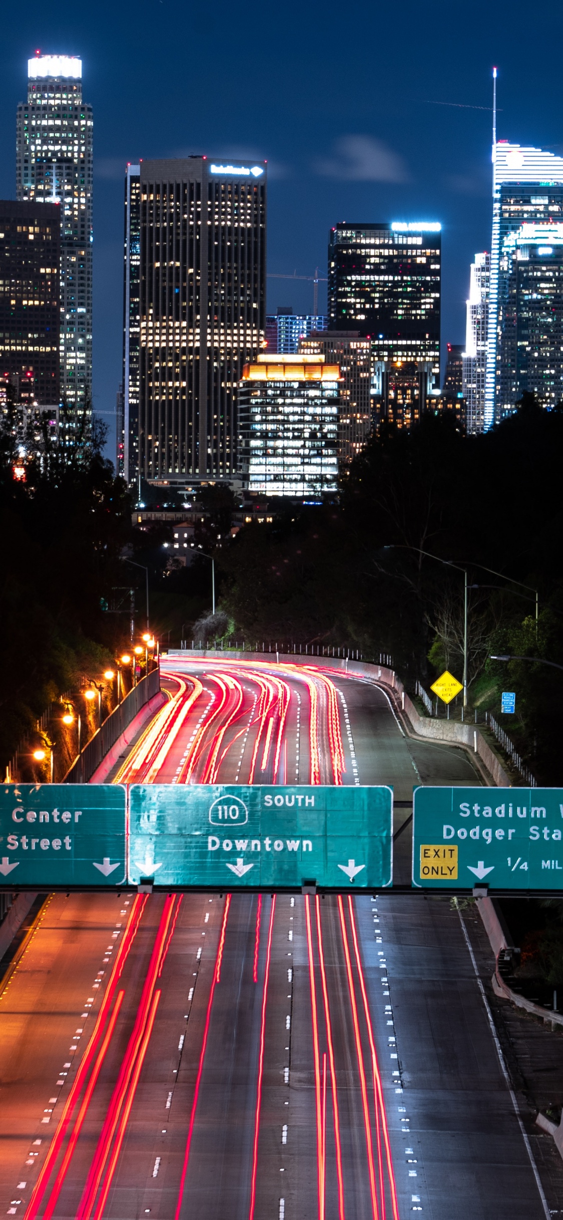 Time Lapse Photography of City During Night Time. Wallpaper in 1125x2436 Resolution