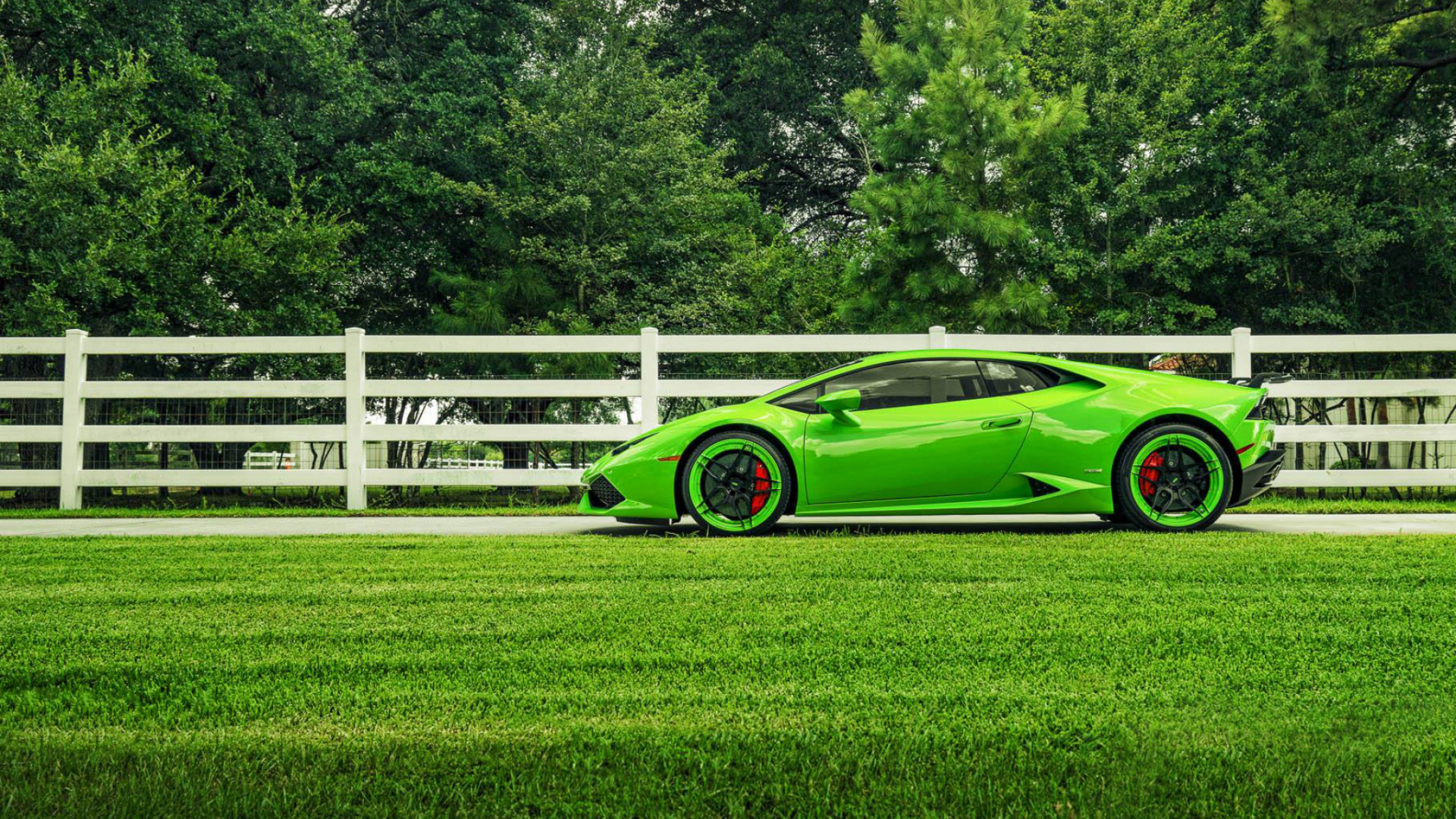 Green Coupe Parked on Green Grass Field During Daytime. Wallpaper in 1920x1080 Resolution