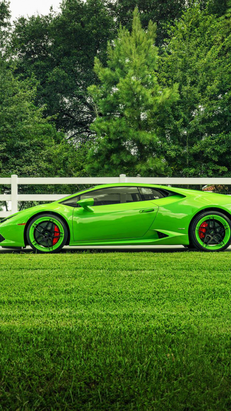 Green Coupe Parked on Green Grass Field During Daytime. Wallpaper in 750x1334 Resolution