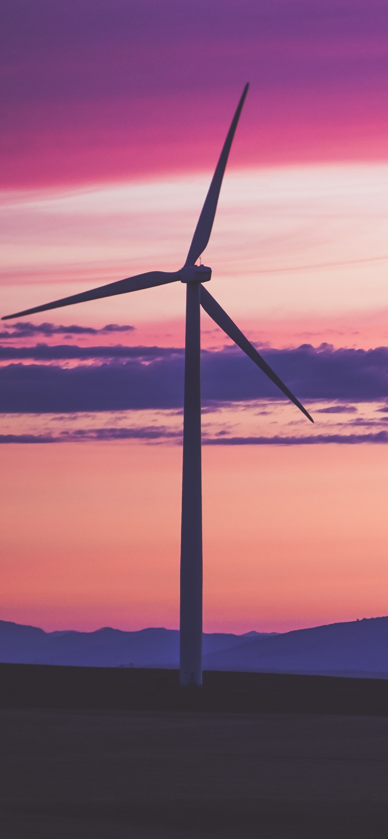 Wind Turbine on Hill During Sunset. Wallpaper in 1242x2688 Resolution
