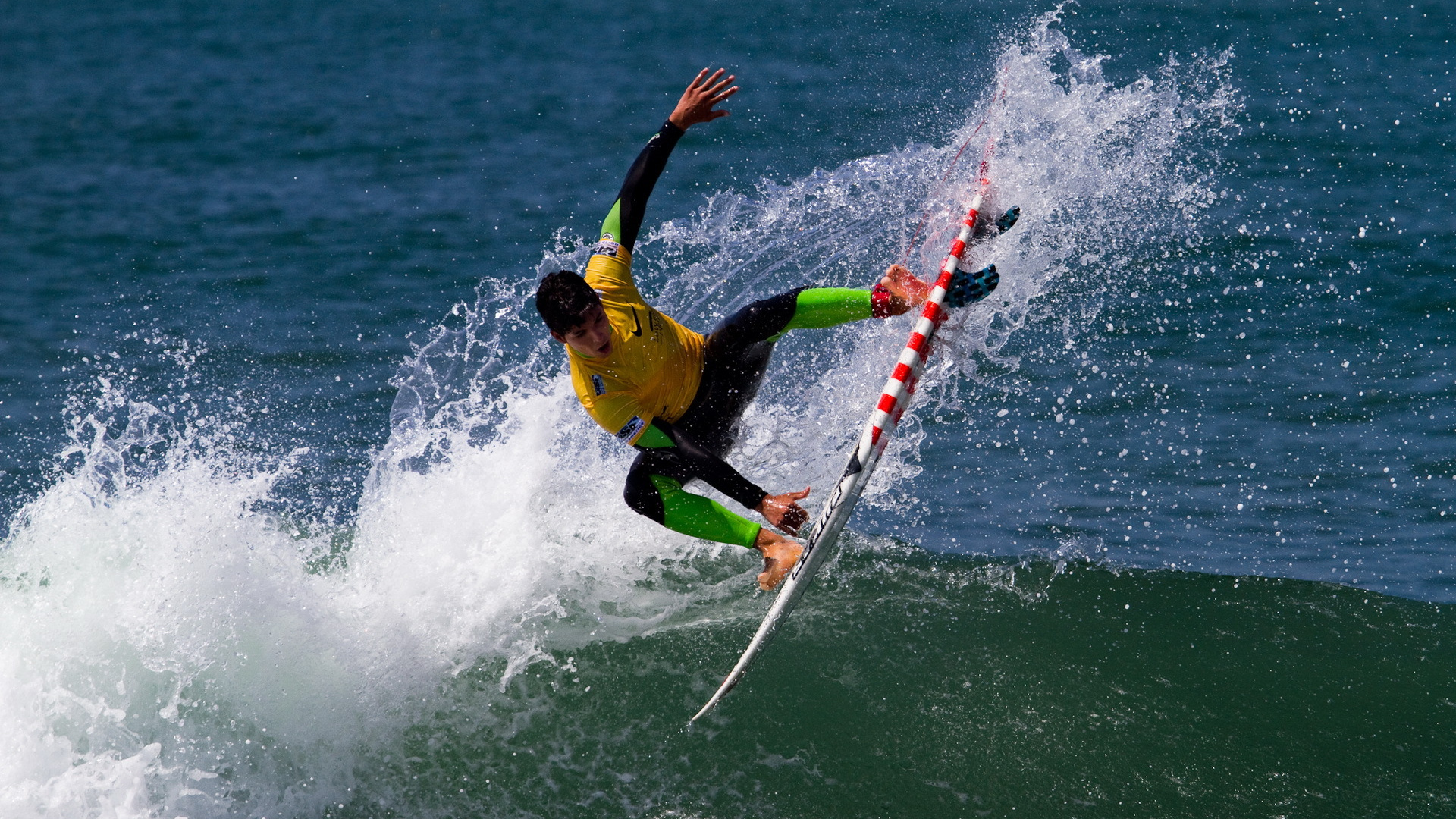 Man in Yellow Shirt and Black Shorts Surfing on Sea Waves During Daytime. Wallpaper in 1920x1080 Resolution