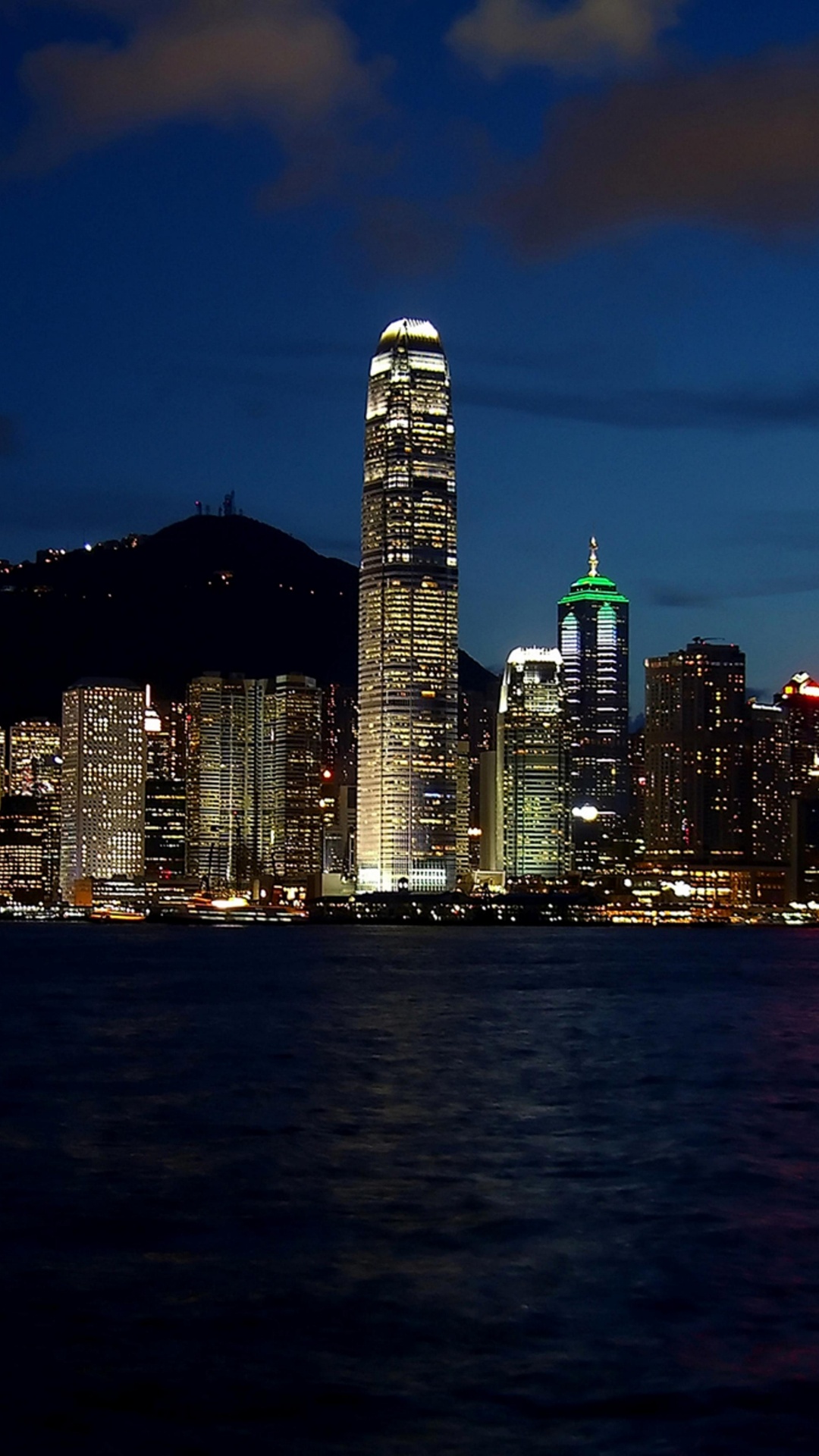City Skyline Across Body of Water During Night Time. Wallpaper in 1080x1920 Resolution