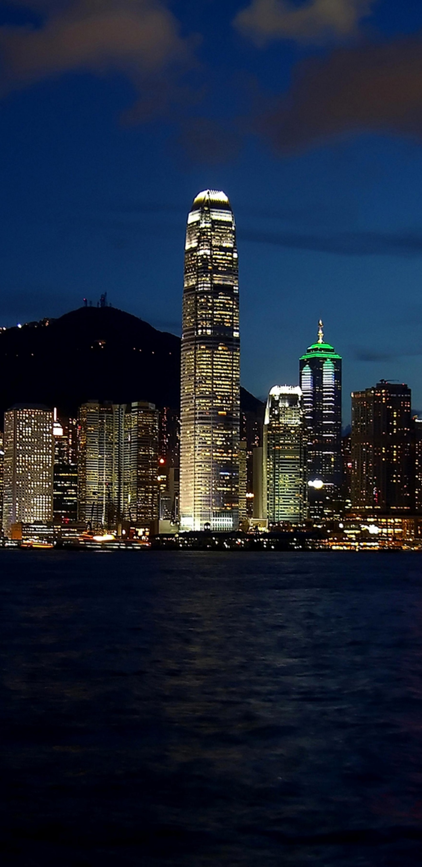 City Skyline Across Body of Water During Night Time. Wallpaper in 1440x2960 Resolution