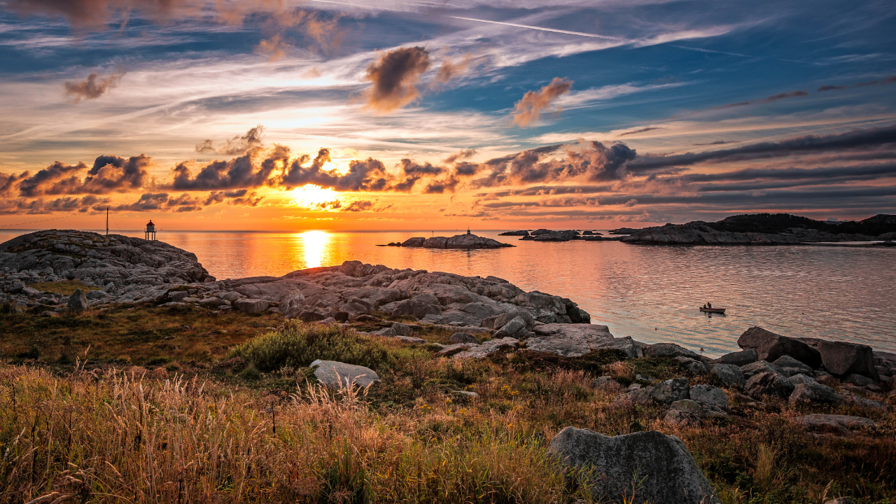 Green Grass Near Body of Water During Sunset. Wallpaper in 1280x720 Resolution