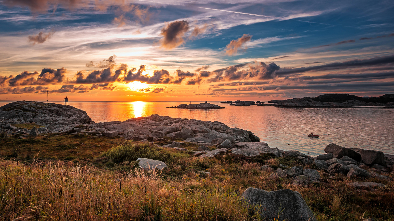 Green Grass Near Body of Water During Sunset. Wallpaper in 1366x768 Resolution