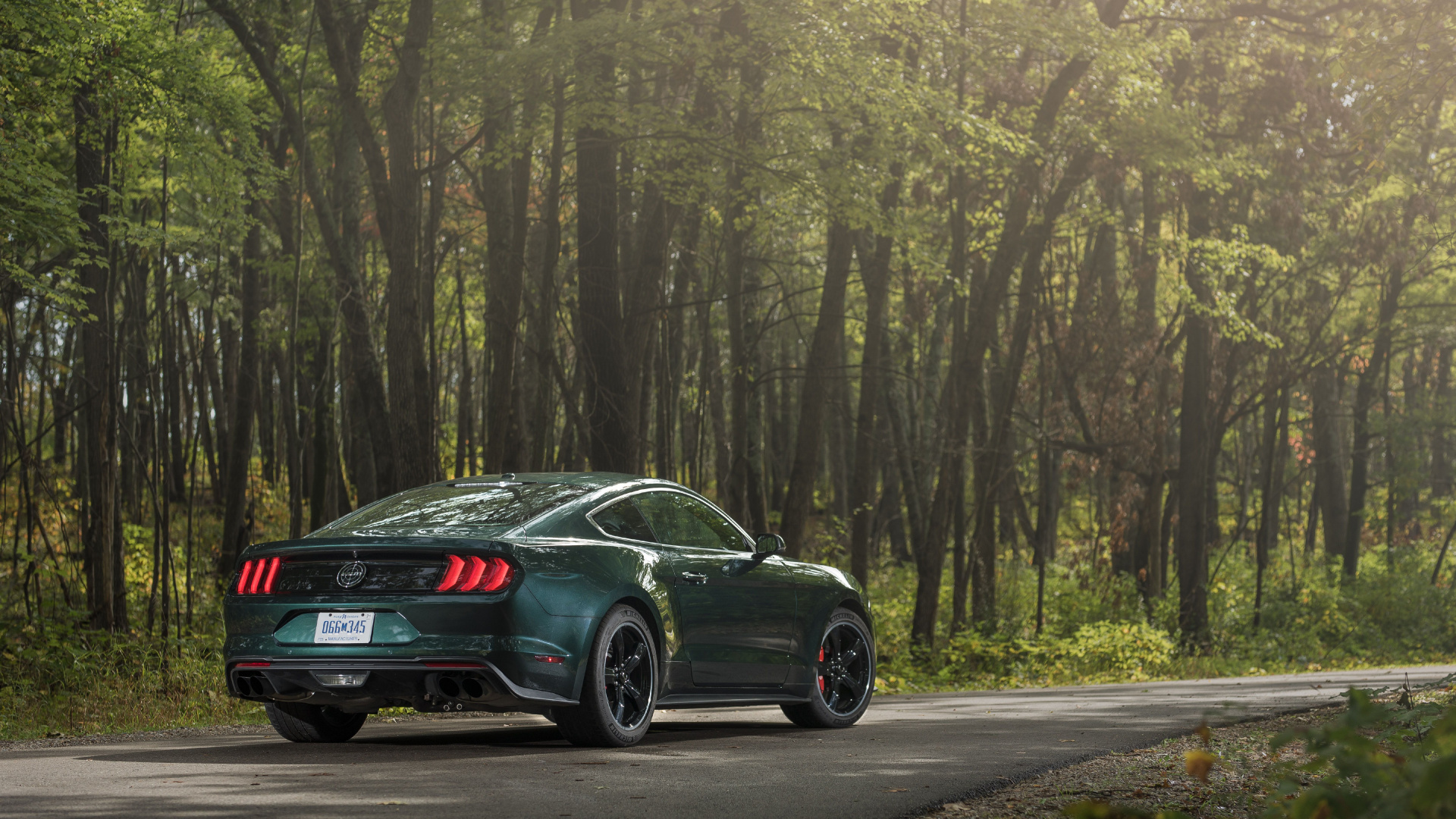 Black Sedan on Road in Between Trees During Daytime. Wallpaper in 1920x1080 Resolution